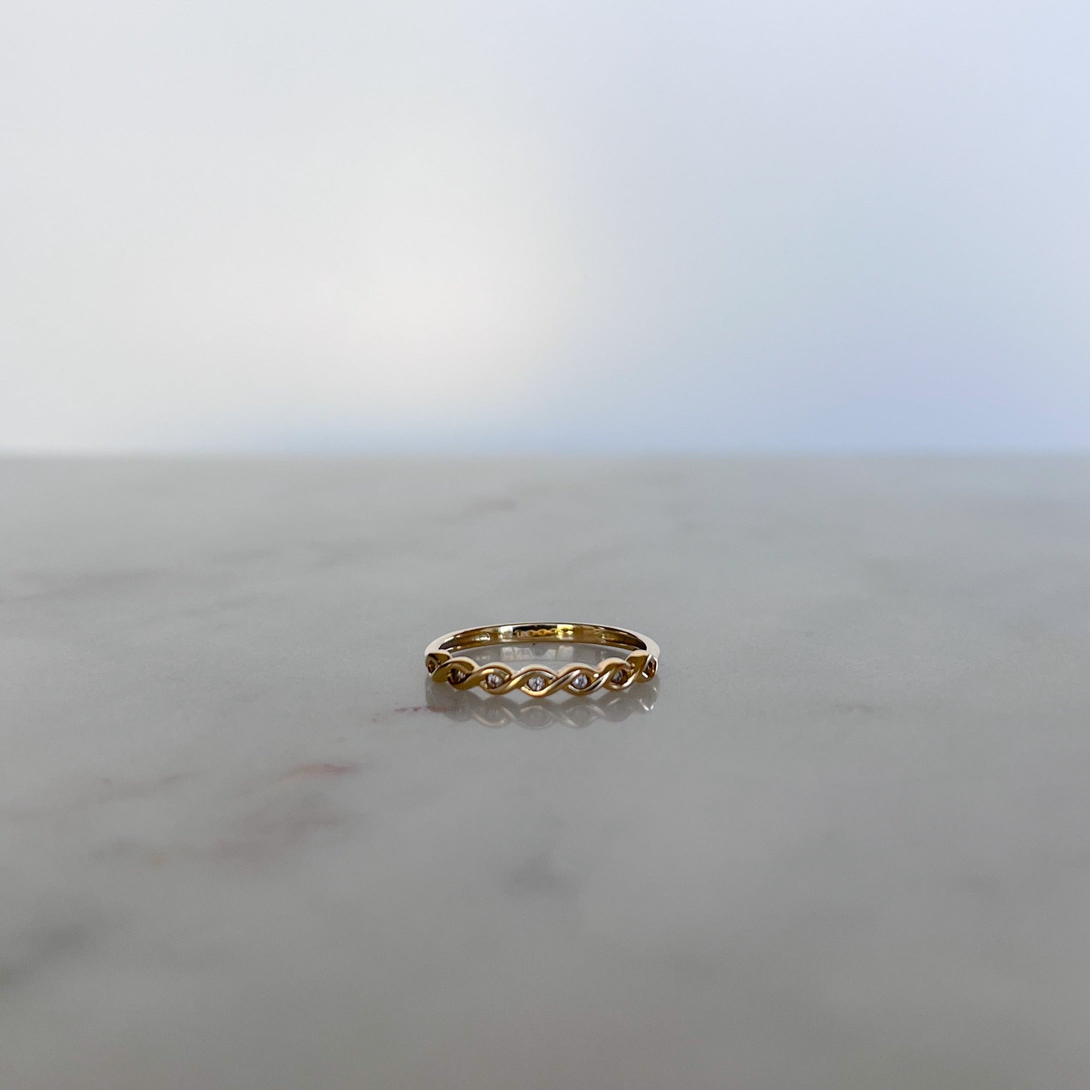 product image of a gold ring with cz stones