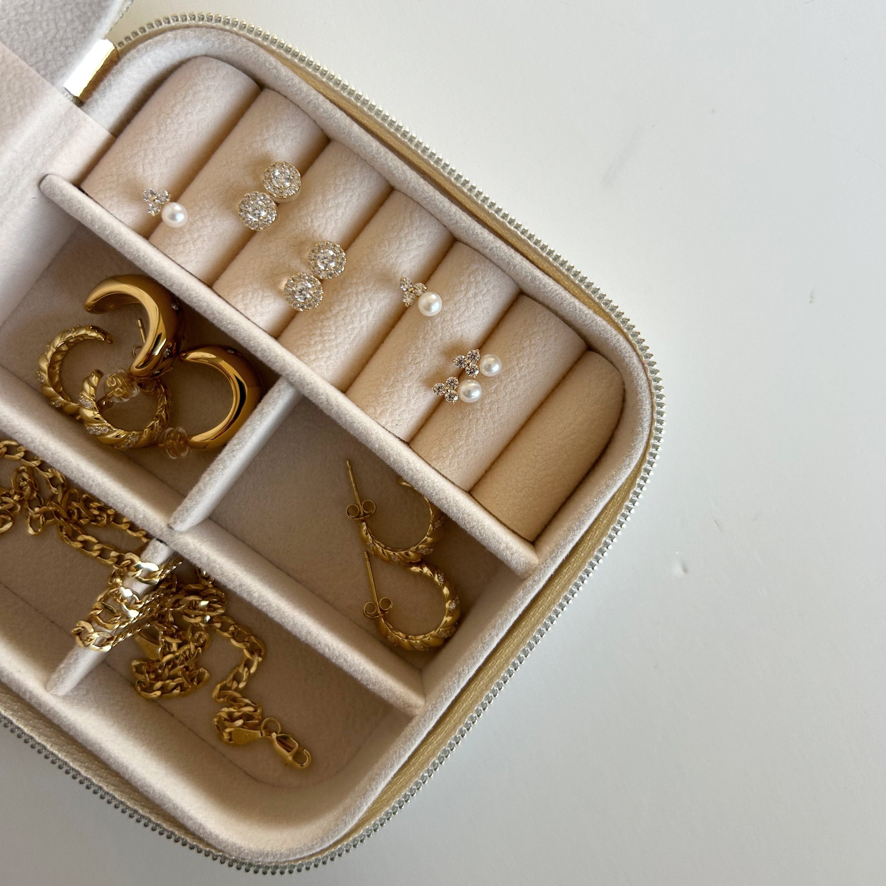 image of multiple earrings in a travel case