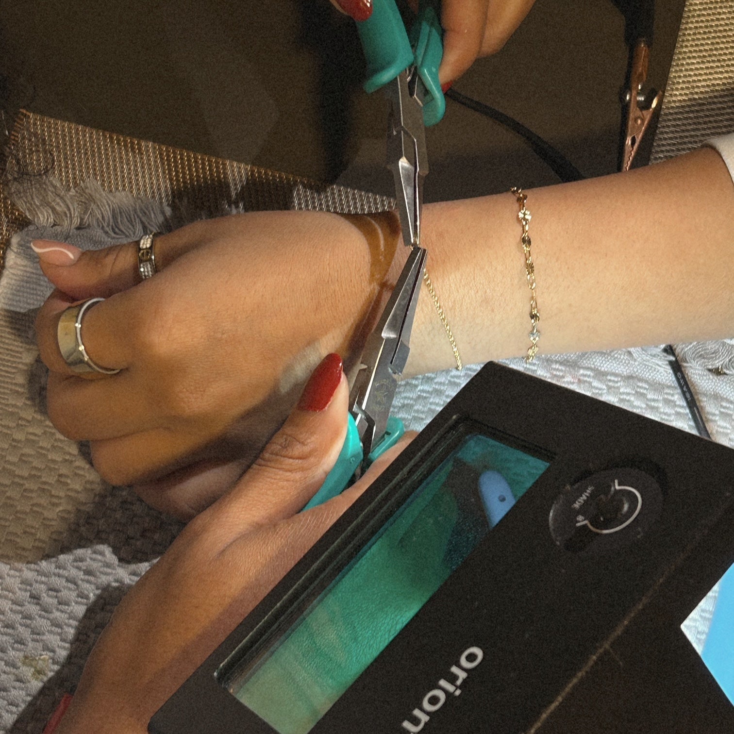 image of a woman doing permanent jewelry