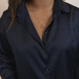 image of model wearing  a gold letter pendant with the letter c