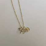 image of multiple pendant charms on a gold necklace