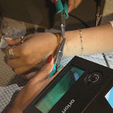 image of a woman doing permanent jewelry 
